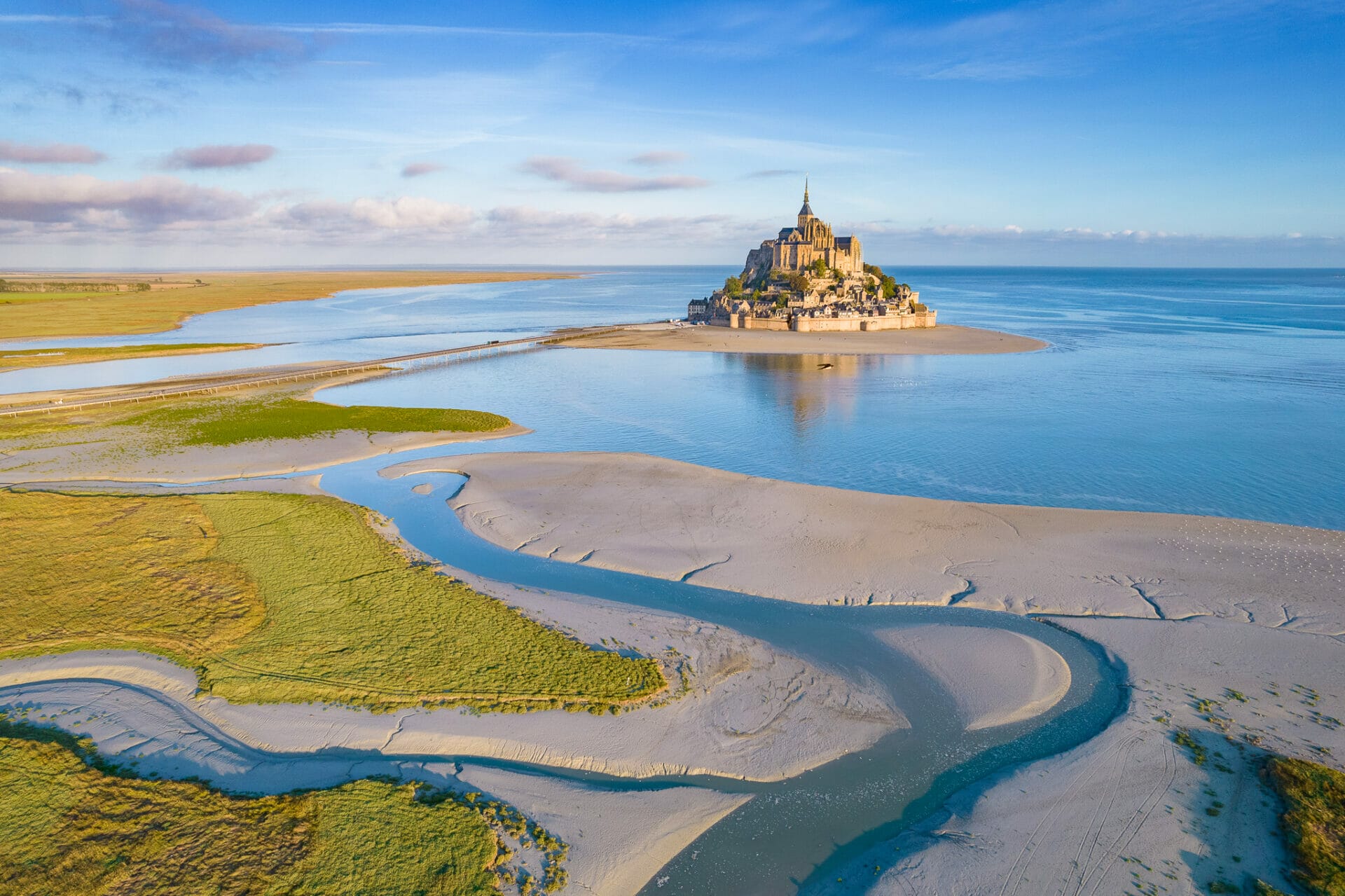 Aerial view of Mont Saint Michel during high tide at sunrise